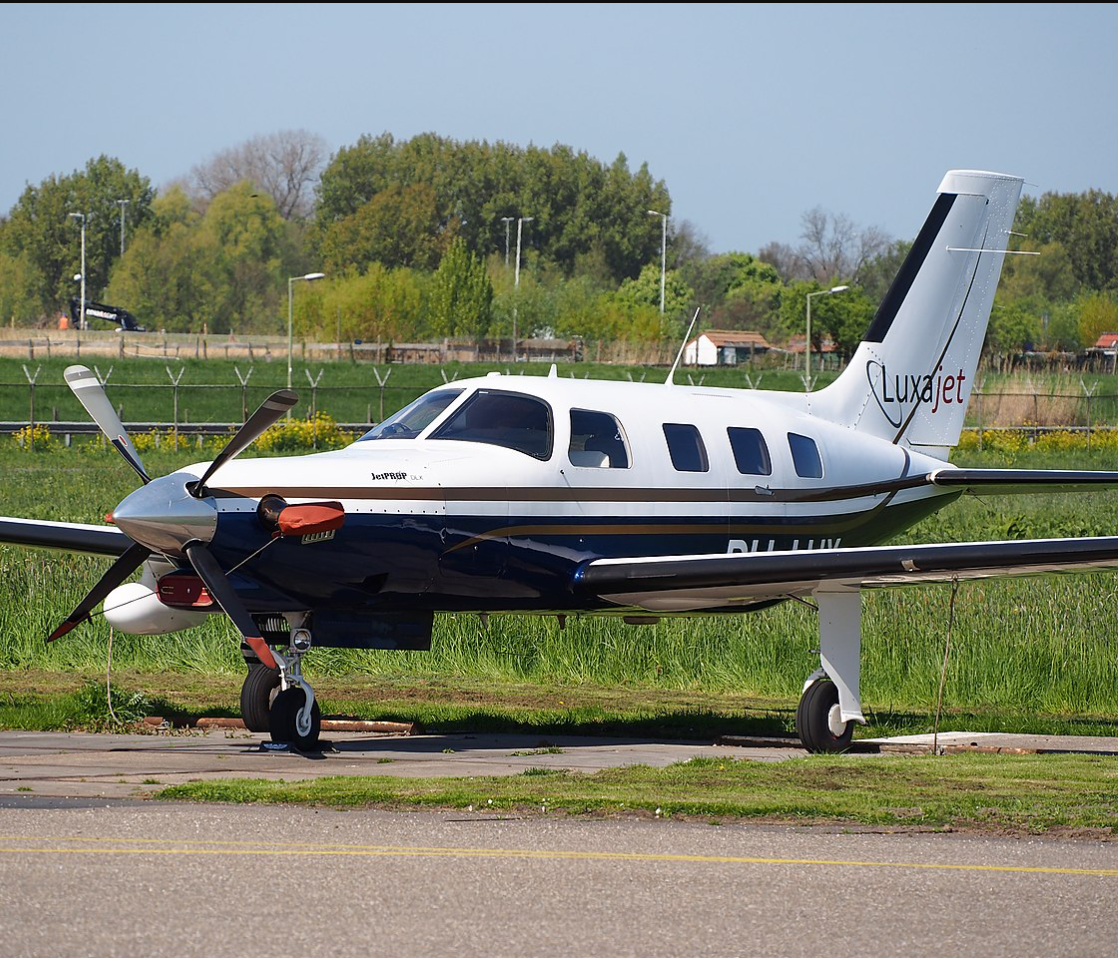 Piper M350 parked at an airfield